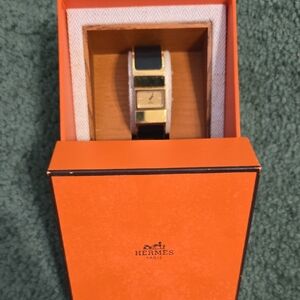 Hermes Gold Tone and Black Cuff Watch